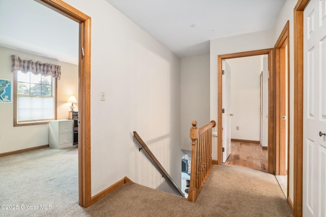 77 Rotterdam Dr, Bethlehem, NY 12077 - hallway with an upstairs landing and carpet floors