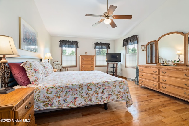 77 Rotterdam Dr, Bethlehem, NY 12077 - bedroom featuring multiple windows, light wood-type flooring, lofted ceiling, and a ceiling fan