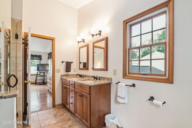 77 Rotterdam Dr, Bethlehem, NY 12077 - bathroom featuring double vanity and a tile shower