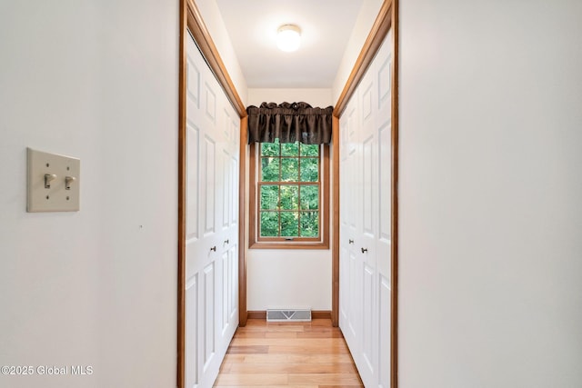 77 Rotterdam Dr, Bethlehem, NY 12077 - hallway with light wood-style floors and baseboards