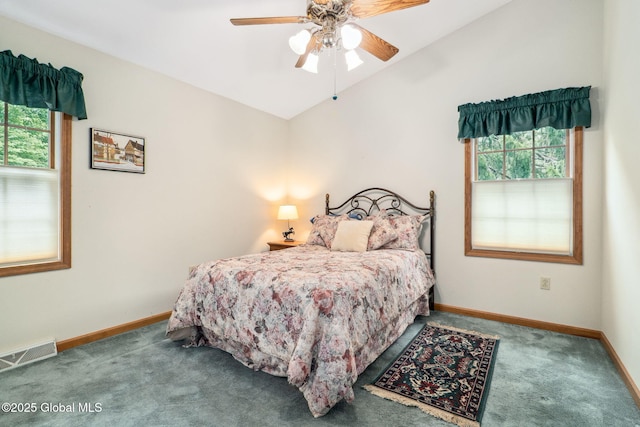 77 Rotterdam Dr, Bethlehem, NY 12077 - bedroom with multiple windows, carpet flooring, vaulted ceiling, and a ceiling fan