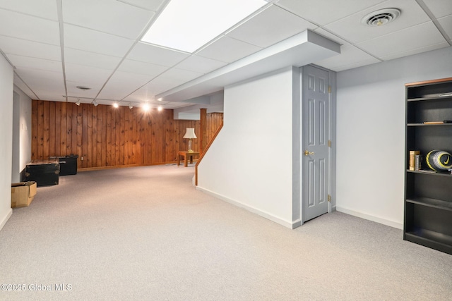 77 Rotterdam Dr, Bethlehem, NY 12077 - finished below grade area featuring wood walls, carpet flooring, and a paneled ceiling