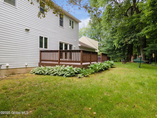 77 Rotterdam Dr, Bethlehem, NY 12077 - back of house featuring a wooden deck and a yard