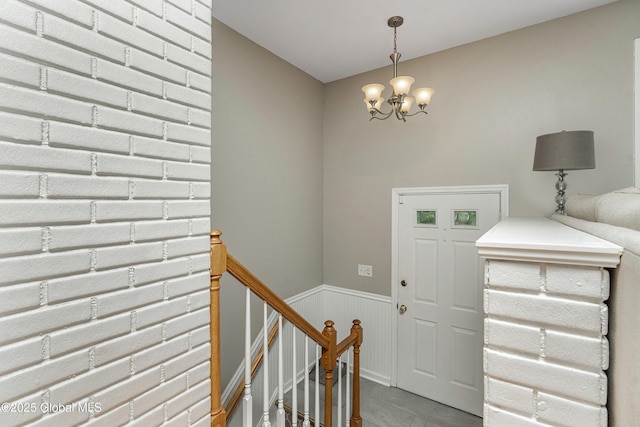 47 Comely Ln, Colonie, NY 12110 - entryway featuring a chandelier and a wainscoted wall