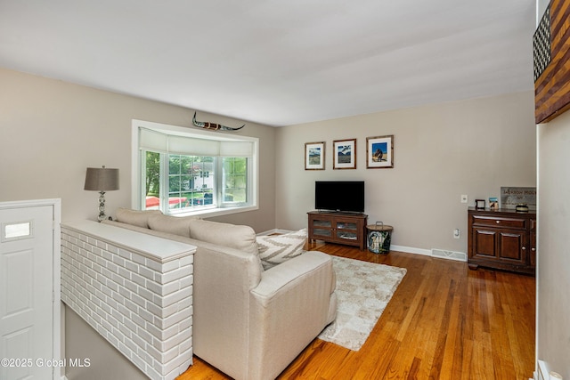 47 Comely Ln, Colonie, NY 12110 - living area with wood finished floors and baseboards