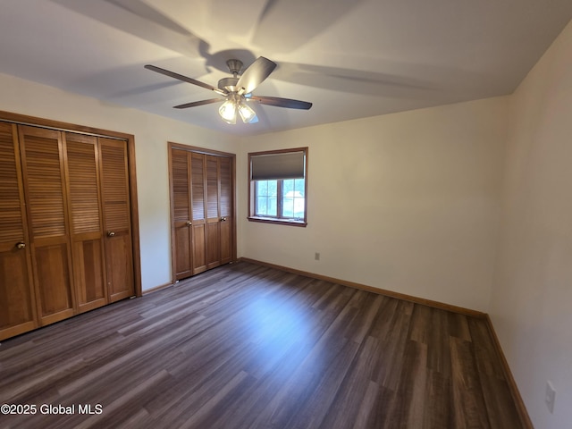 222 S Ten Broeck St Unit 26, Scotia, NY 12302 - unfurnished bedroom featuring multiple closets, dark wood-style floors, and ceiling fan