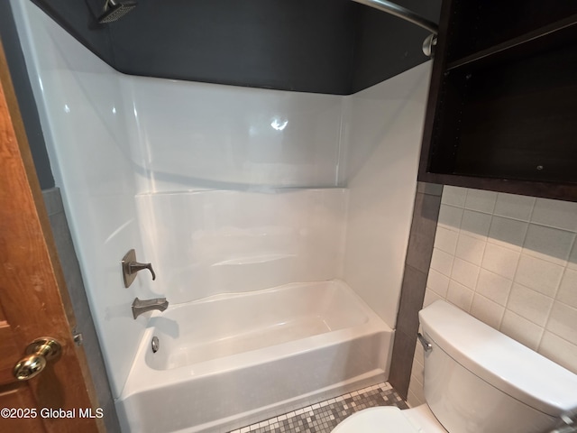 222 S Ten Broeck St Unit 26, Scotia, NY 12302 - bathroom featuring tub / shower combination, tile walls, and tile patterned flooring