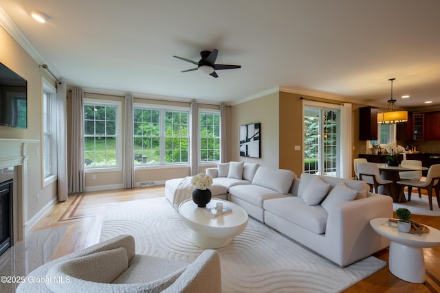 1 Arbor Dr, Guilderland, NY 12159 - living area with ceiling fan, ornamental molding, light wood finished floors, a fireplace, and recessed lighting