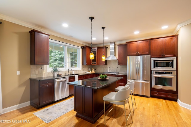 1 Arbor Dr, Guilderland, NY 12159 - kitchen featuring stainless steel appliances, wall chimney range hood, crown molding, a kitchen island, and light wood-type flooring