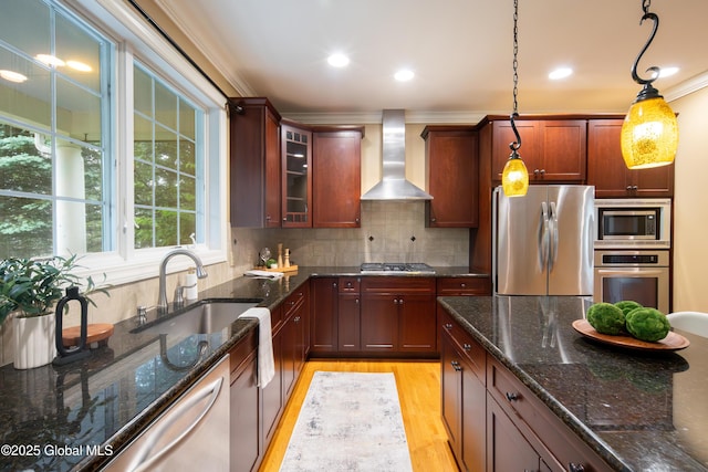 1 Arbor Dr, Guilderland, NY 12159 - kitchen featuring stainless steel appliances, wall chimney range hood, light wood-style floors, hanging light fixtures, and ornamental molding