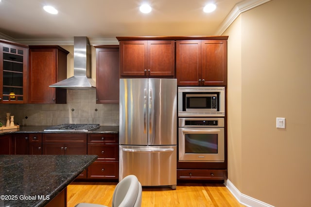 1 Arbor Dr, Guilderland, NY 12159 - kitchen featuring stainless steel appliances, wall chimney range hood, light wood-type flooring, crown molding, and tasteful backsplash