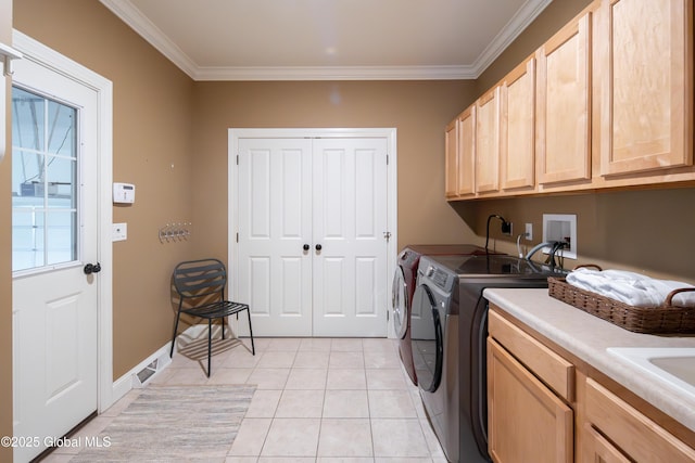 1 Arbor Dr, Guilderland, NY 12159 - laundry room featuring cabinet space, washer and dryer, crown molding, and light tile patterned floors