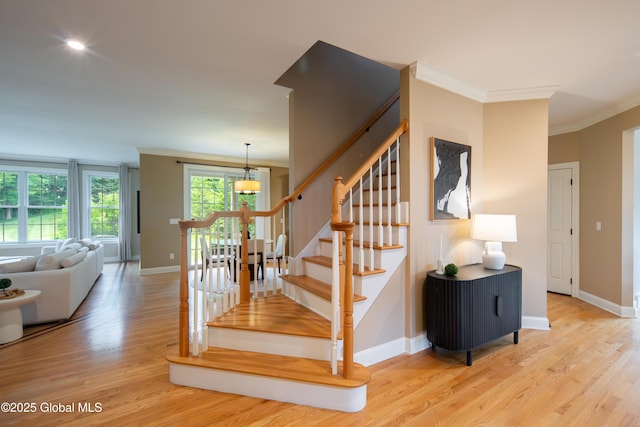 1 Arbor Dr, Guilderland, NY 12159 - staircase with crown molding and wood finished floors