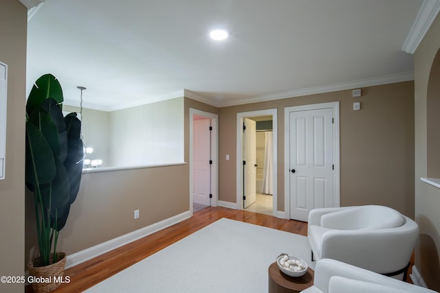 1 Arbor Dr, Guilderland, NY 12159 - sitting room with wood finished floors, crown molding, and recessed lighting