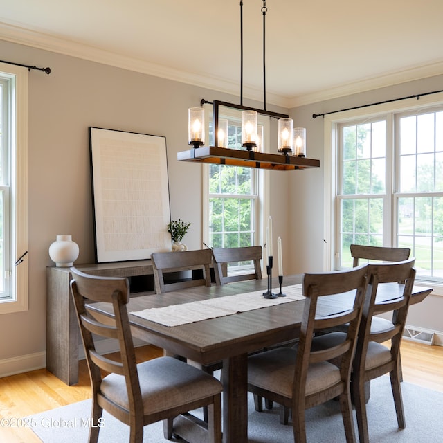 1 Arbor Dr, Guilderland, NY 12159 - dining room with a chandelier, light wood-style flooring, and ornamental molding