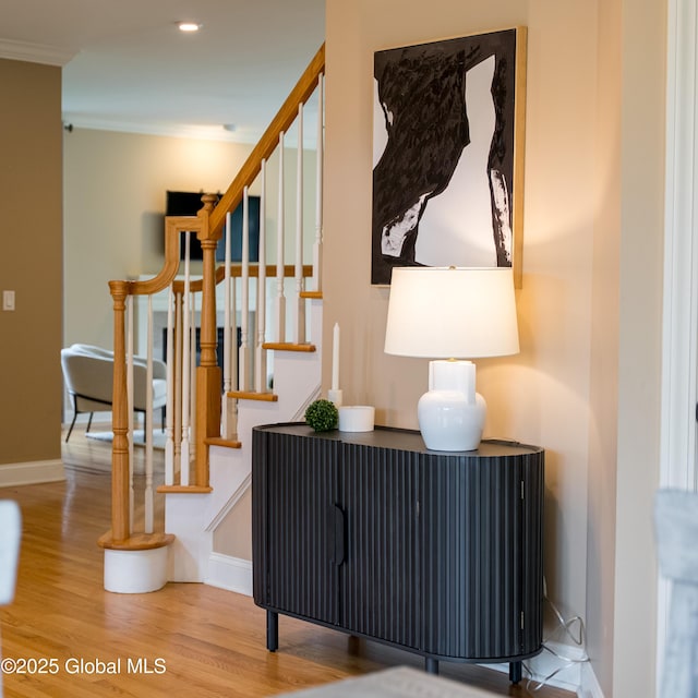1 Arbor Dr, Guilderland, NY 12159 - stairs featuring wood finished floors, ornamental molding, and recessed lighting