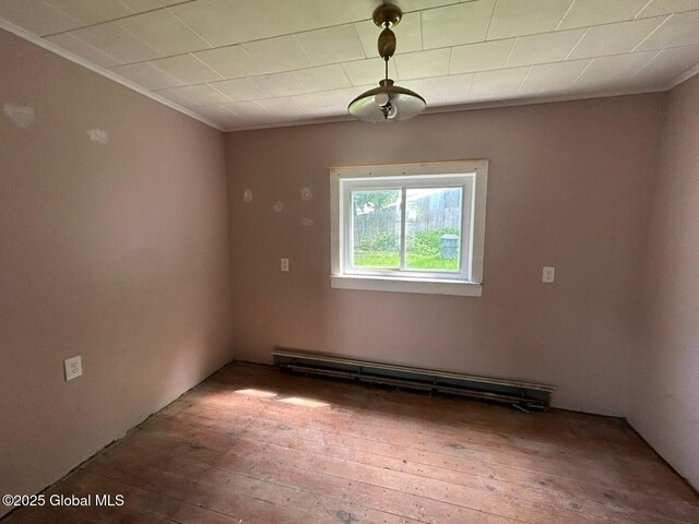 4 Factory St, Granville, NY 12832 - unfurnished room featuring hardwood / wood-style floors, ornamental molding, and a baseboard radiator