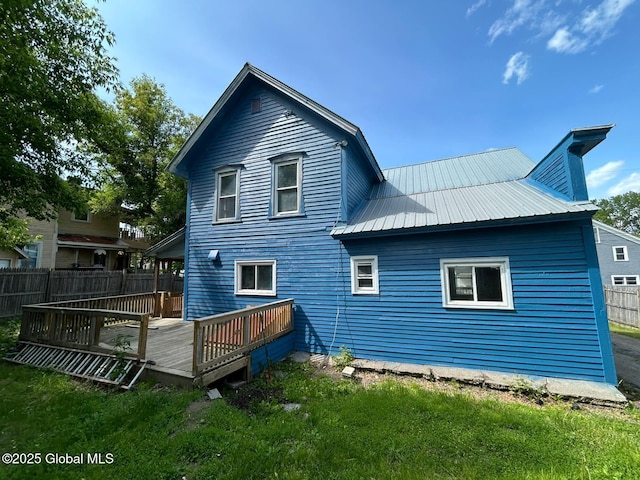 4 Factory St, Granville, NY 12832 - rear view of house with a wooden deck and a metal roof