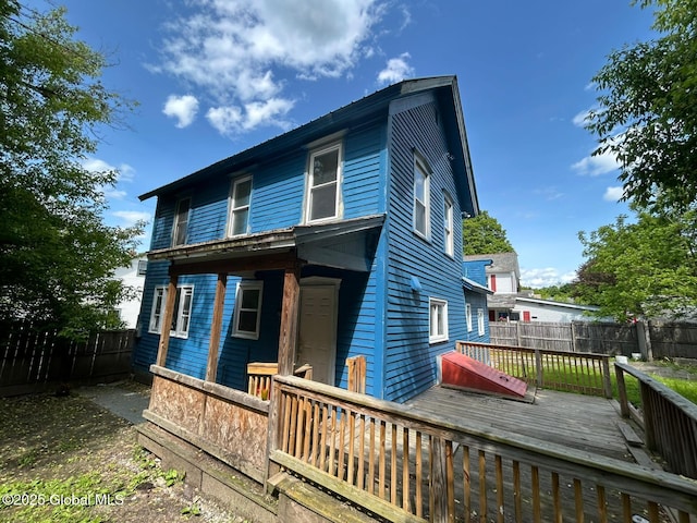 4 Factory St, Granville, NY 12832 - rear view of house with a deck and a fenced backyard