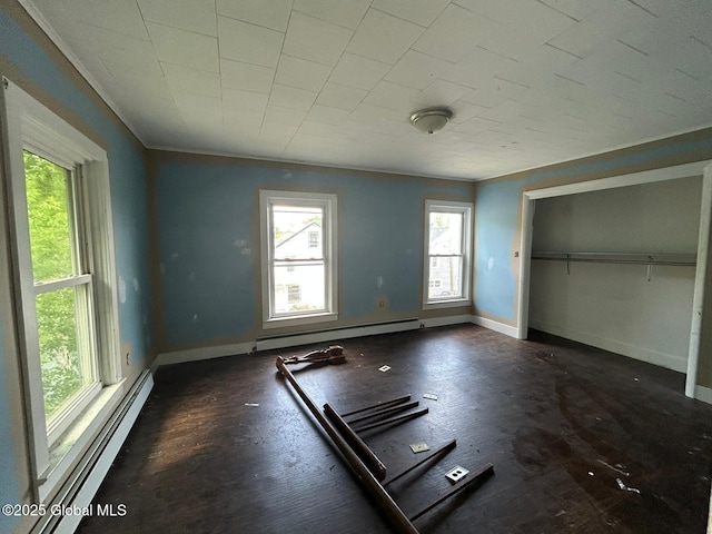 4 Factory St, Granville, NY 12832 - unfurnished bedroom featuring a baseboard heating unit and a closet