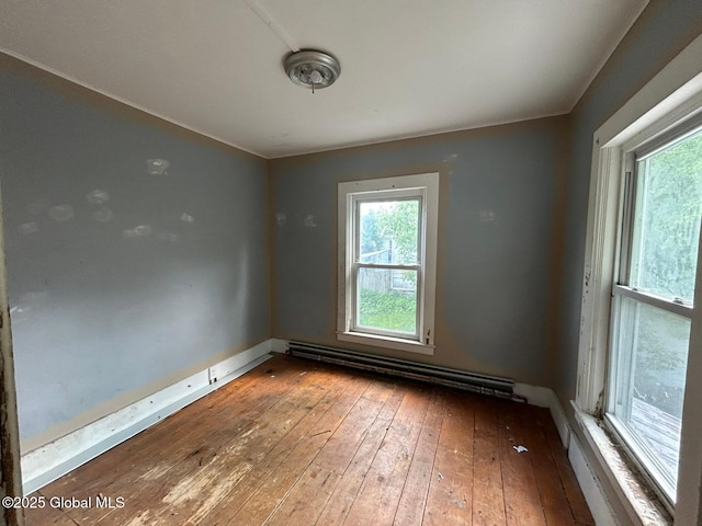 4 Factory St, Granville, NY 12832 - spare room featuring a baseboard heating unit and hardwood / wood-style floors