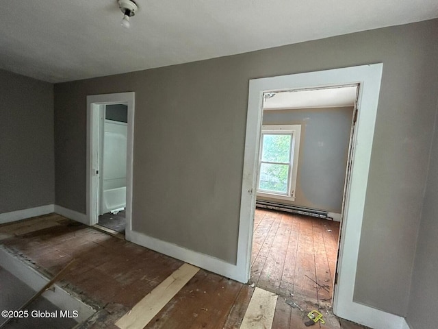 4 Factory St, Granville, NY 12832 - spare room with a baseboard radiator and wood-type flooring
