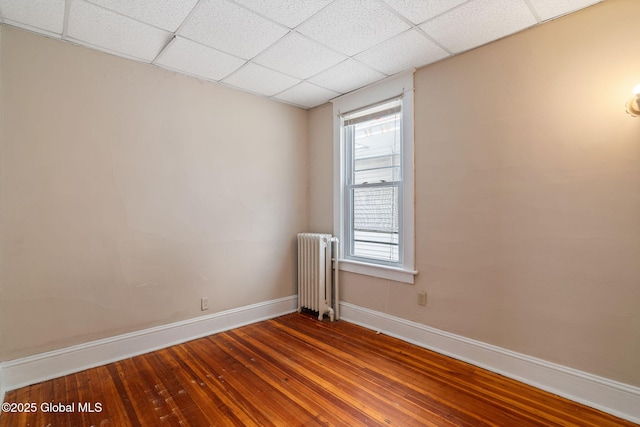 13 Barclay St, Albany, NY 12209 - spare room with radiator, hardwood / wood-style flooring, and a drop ceiling