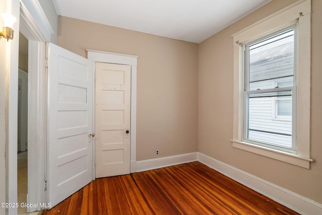 13 Barclay St, Albany, NY 12209 - spare room featuring dark wood-type flooring and baseboards