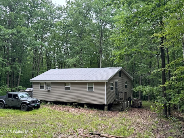 70 Cp A Way, Hartford, NY 12832 - view of side of home with a forest view and a metal roof