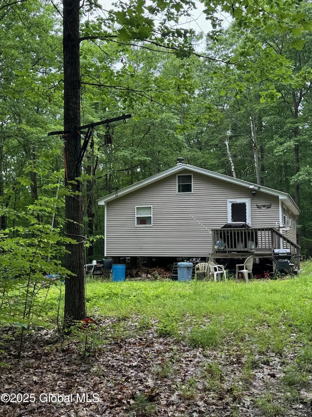 70 Cp A Way, Hartford, NY 12832 - back of property with a deck and a wooded view