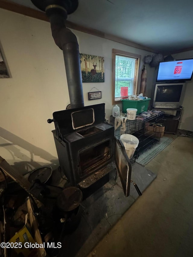 70 Cp A Way, Hartford, NY 12832 - detailed view of a wood stove and unfinished concrete flooring