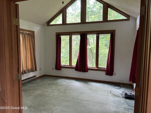11 Ridgecrest Way, Hampton, NY 12887 - carpeted spare room featuring a baseboard radiator, lofted ceiling, and a textured ceiling