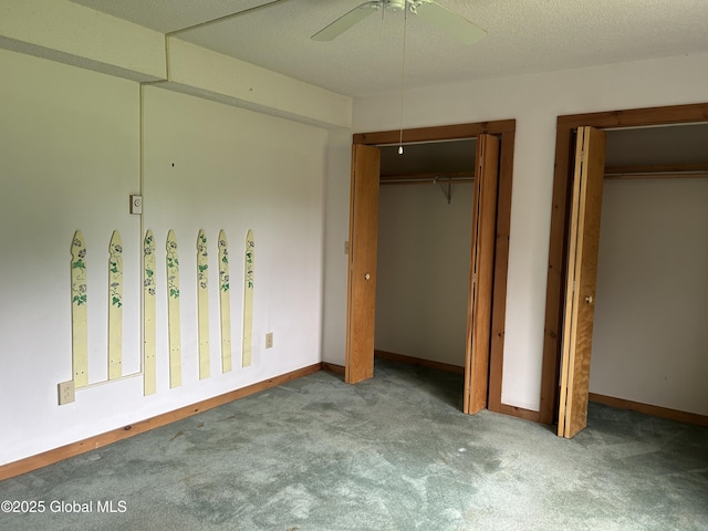 11 Ridgecrest Way, Hampton, NY 12887 - unfurnished bedroom with carpet, two closets, and a ceiling fan