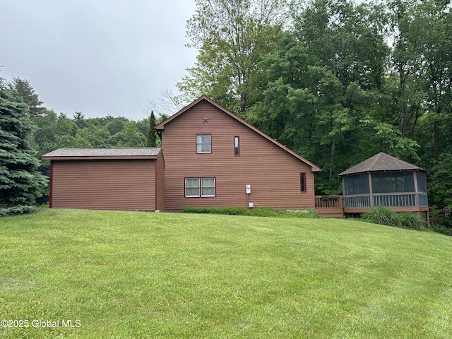 11 Ridgecrest Way, Hampton, NY 12887 - view of home's exterior featuring a sunroom, a yard, and a wooden deck