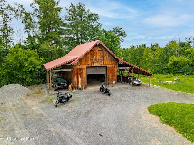 2560 Creek Rd, Esperance, NY 12066 - view of parking / parking lot with a detached garage and dirt driveway