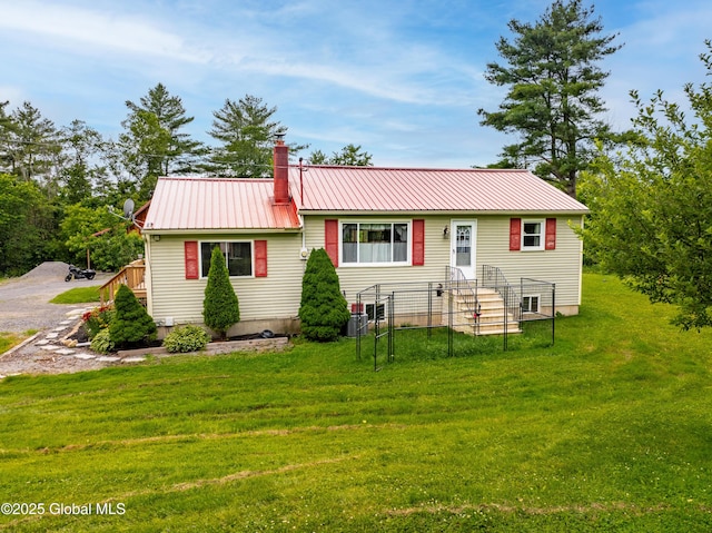 2560 Creek Rd, Esperance, NY 12066 - view of front of home featuring a metal roof, a front yard, and a chimney