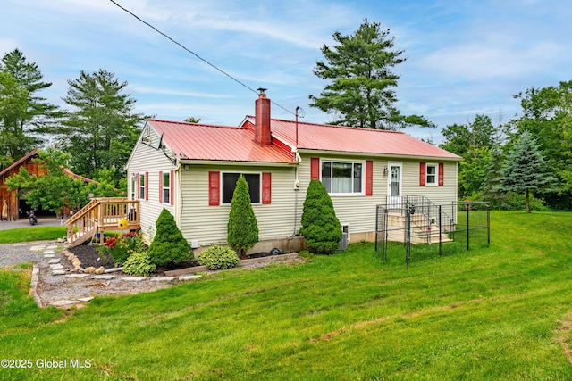 2560 Creek Rd, Esperance, NY 12066 - rear view of house featuring a chimney, a lawn, and a metal roof