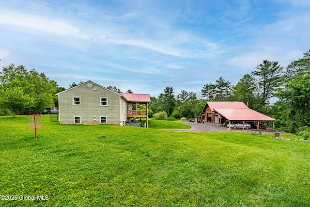 2560 Creek Rd, Esperance, NY 12066 - back of property featuring a lawn, a deck, and view of wooded area