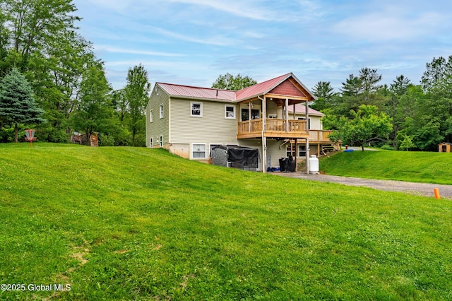 2560 Creek Rd, Esperance, NY 12066 - back of house featuring a lawn, a metal roof, and a wooden deck