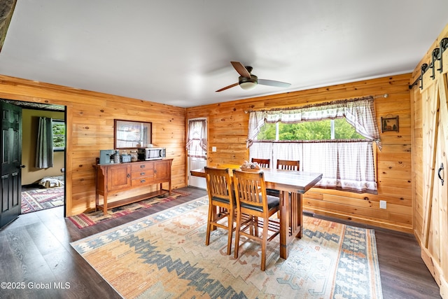 2560 Creek Rd, Esperance, NY 12066 - dining space with wood finished floors, a ceiling fan, and wooden walls