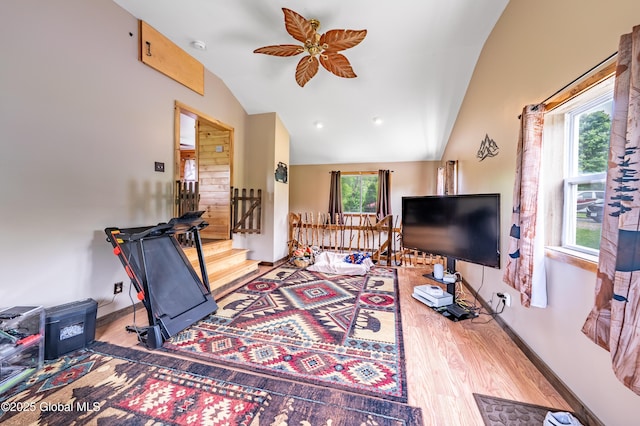 2560 Creek Rd, Esperance, NY 12066 - living room with vaulted ceiling, wood finished floors, a ceiling fan, and stairs