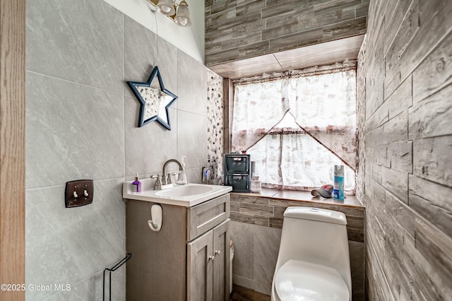 2560 Creek Rd, Esperance, NY 12066 - half bathroom featuring vanity and tile walls