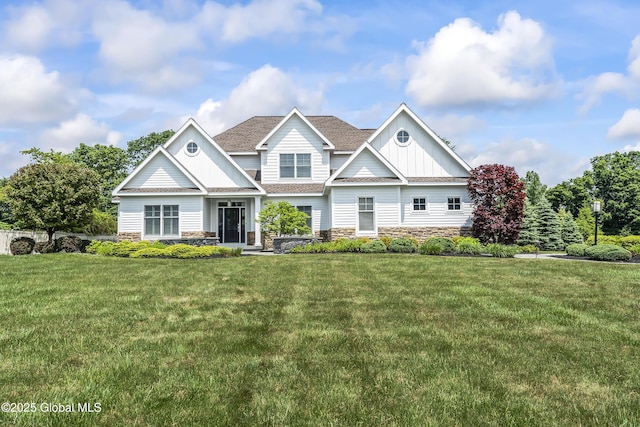 23 Steeple View Dr, Colonie, NY 12211 - craftsman-style house featuring board and batten siding, stone siding, a front yard, and a shingled roof