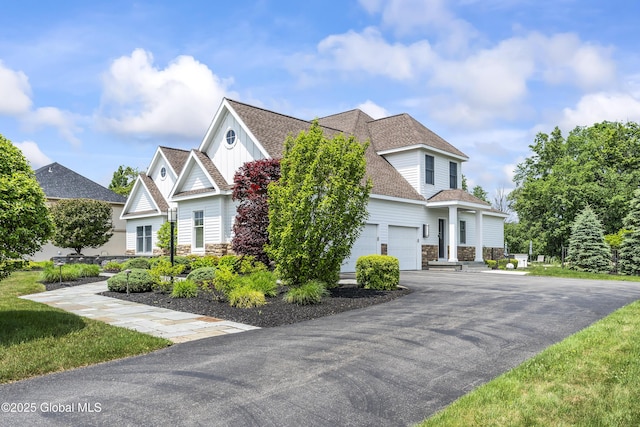 23 Steeple View Dr, Colonie, NY 12211 - craftsman-style home featuring stone siding, asphalt driveway, a garage, and a shingled roof