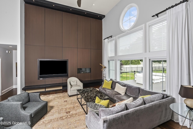 23 Steeple View Dr, Colonie, NY 12211 - living room featuring a high ceiling and wood finished floors