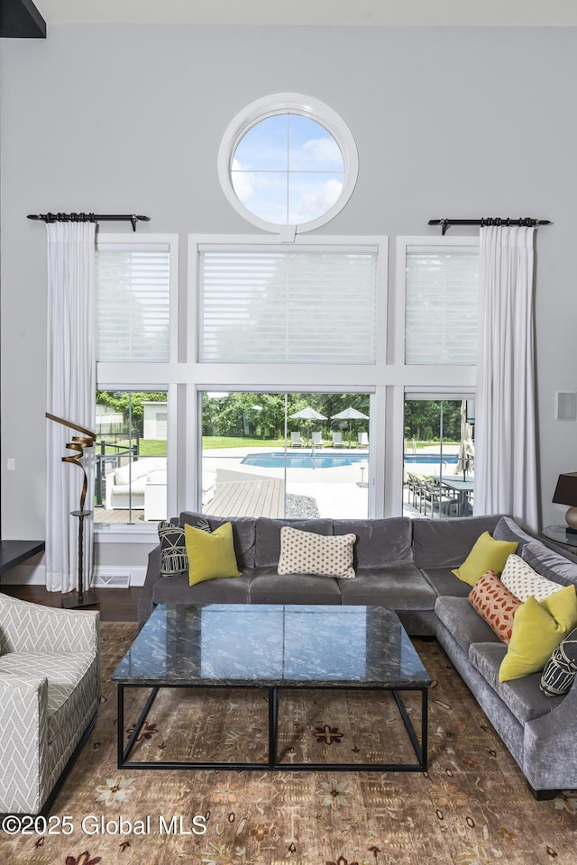 23 Steeple View Dr, Colonie, NY 12211 - living room featuring wood finished floors and a high ceiling