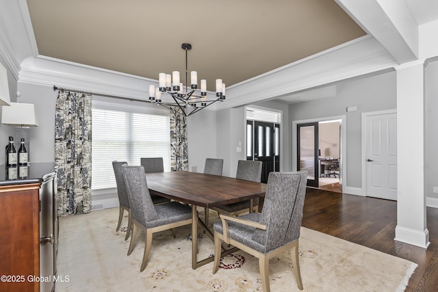23 Steeple View Dr, Colonie, NY 12211 - dining space with crown molding, a chandelier, a raised ceiling, and wood finished floors