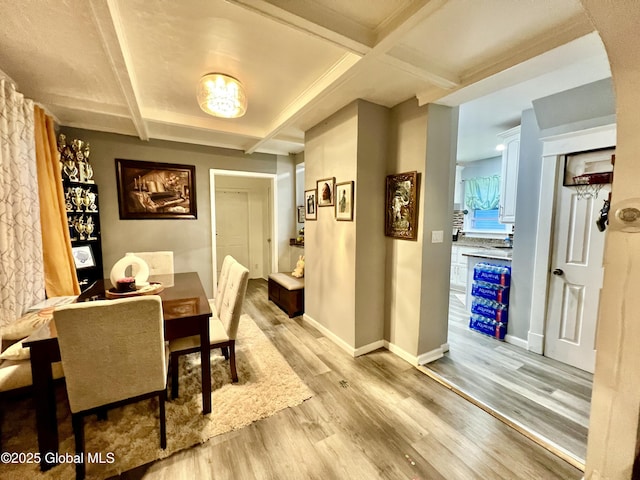 421 Michigan Ave, Schenectady, NY 12303 - dining room with light wood-style flooring, coffered ceiling, and beamed ceiling