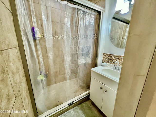 421 Michigan Ave, Schenectady, NY 12303 - bathroom featuring a tile shower, vanity, and tile walls
