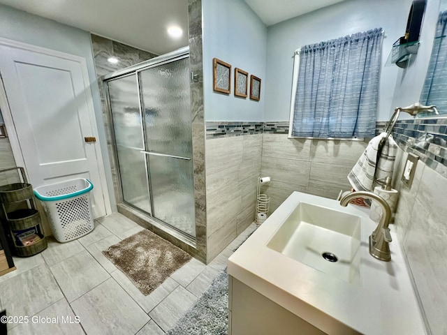 421 Michigan Ave, Schenectady, NY 12303 - bathroom with a stall shower, vanity, and tile walls